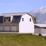 Galvanized steel barndominiums in Picture Rocks, Arizona, with stunning desert backdrop and modern design