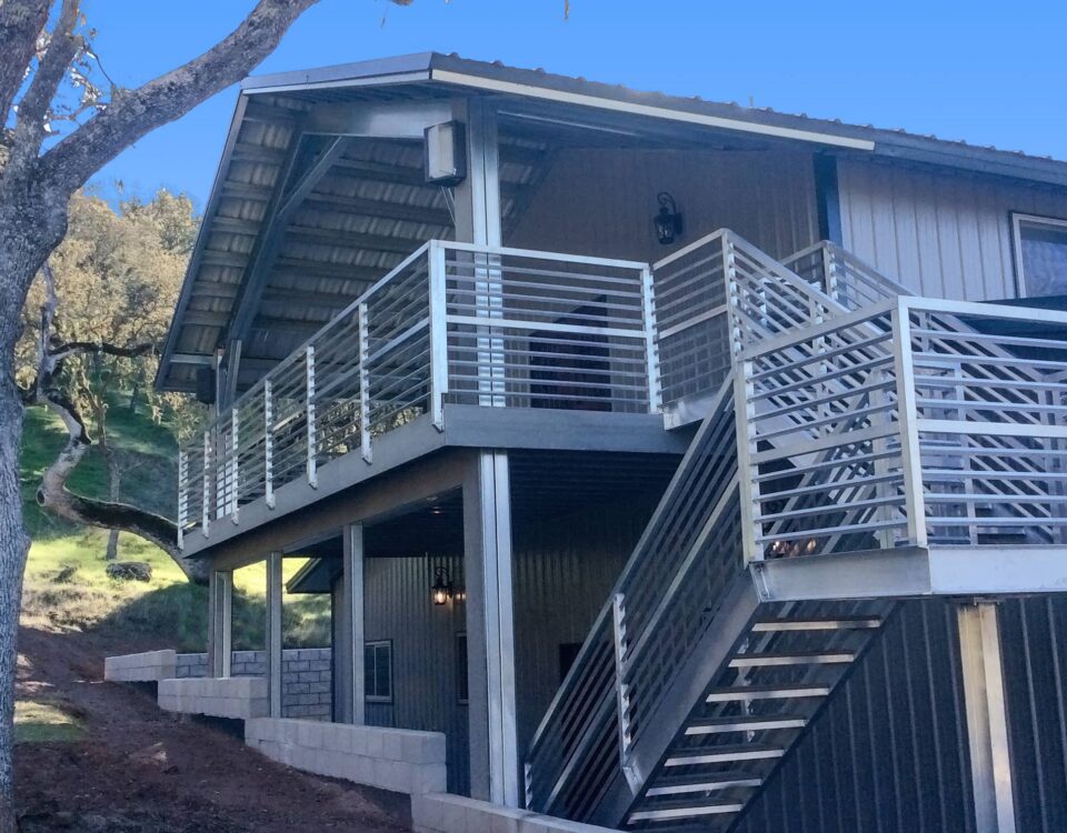 Exterior view of galvanized steel barndominiums in Saddle Brooke, Arizona, highlighting modern design and rural charm