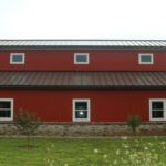 Modern galvanized steel barndominiums in Safford, Arizona showcasing sustainability and rustic charm