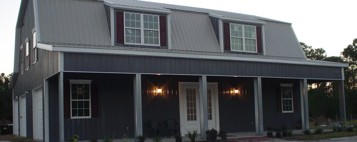 Exterior view of galvanized steel barndominiums in Verde Village, Arizona, showcasing modern design and rural charm